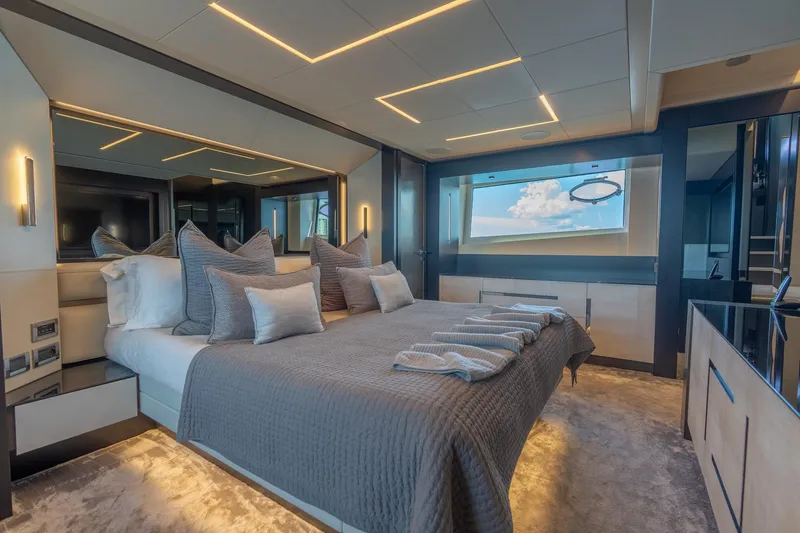 Slide: The Image of Luxurious bedroom interior of 2021 Pershing 9X yacht with modern design and ocean view. - 22