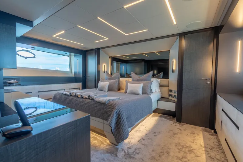 Slide: The Image of Luxurious bedroom interior of 2021 Pershing 9X yacht with modern design and ambient lighting. - 23