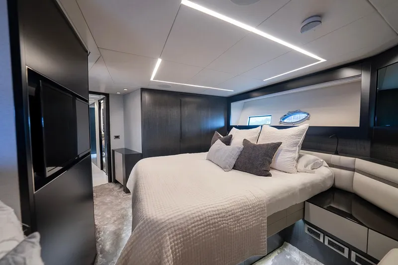 Slide: The Image of Luxurious bedroom interior of 2021 Pershing 9X yacht with modern design and elegant furnishings. - 28