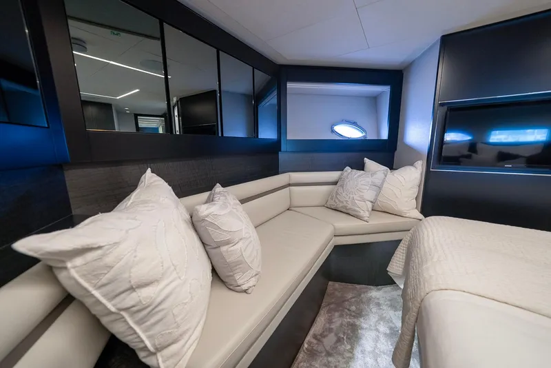 Slide: The Image of Luxurious interior of 2021 Pershing 9X yacht with elegant seating and plush pillows. - 29