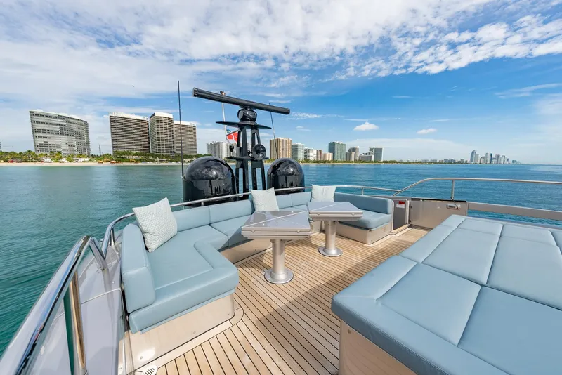 Slide: The Image of Luxurious 2021 Pershing 9X yacht deck with city skyline and ocean view. - 39