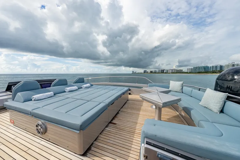 Slide: The Image of Luxurious 2021 Pershing 9X yacht deck with plush seating and ocean view. - 40