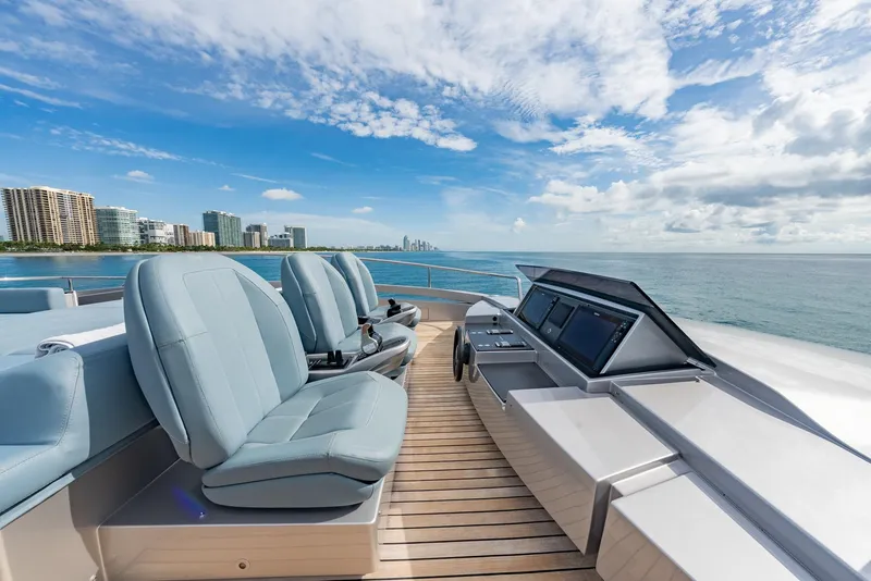 Slide: The Image of Luxurious 2021 Pershing 9X yacht deck with modern seating and ocean view. - 42