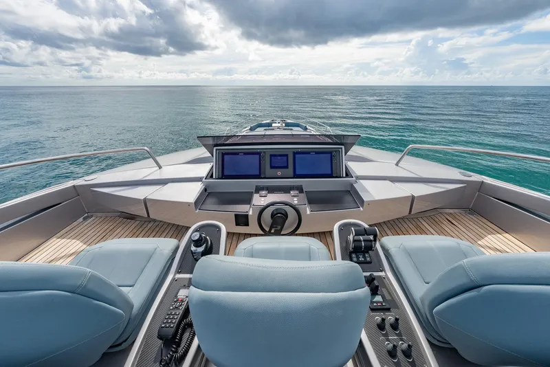 Slide: The Image of Cockpit view of 2021 Pershing 9X yacht with ocean horizon and modern controls. - 43