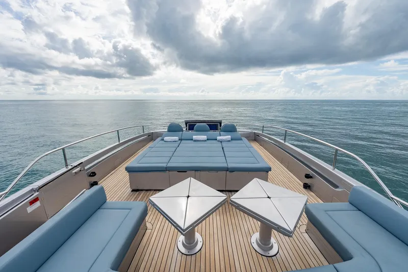 Slide: The Image of Luxurious 2021 Pershing 9X yacht deck with ocean view and elegant seating. - 48