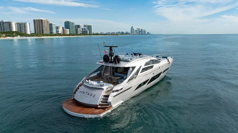 Slide: The Image of Luxury Pershing 9X yacht cruising near city skyline, 2021 model. - 9