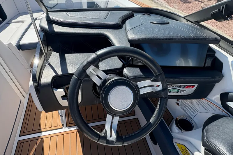 Slide: The Image of 2018 Nautique Super Air Nautique G25 steering wheel and dashboard, featuring sleek design and controls. - 16