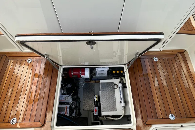 Slide: The Image of 2016 Chris-Craft Launch 36 engine compartment with open hatch, showcasing mechanical components. - 12