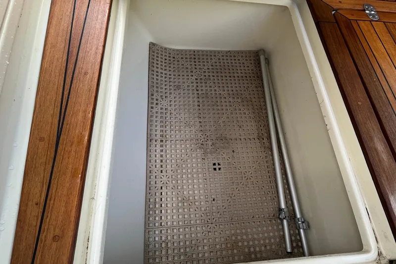 Slide: The Image of Storage compartment on 2016 Chris-Craft Launch 36 boat with wooden trim. - 13