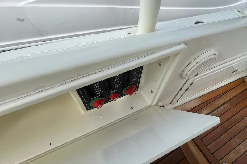 Slide: The Image of 2016 Chris-Craft Launch 36 boat control panel with wooden deck and speaker. - 15
