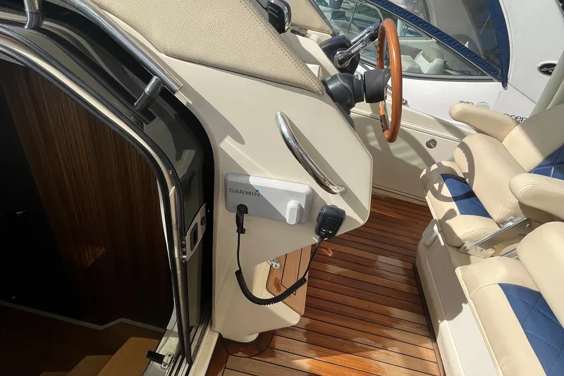 Slide: The Image of 2016 Chris-Craft Launch 36 cockpit with Garmin system and luxurious seating. - 17
