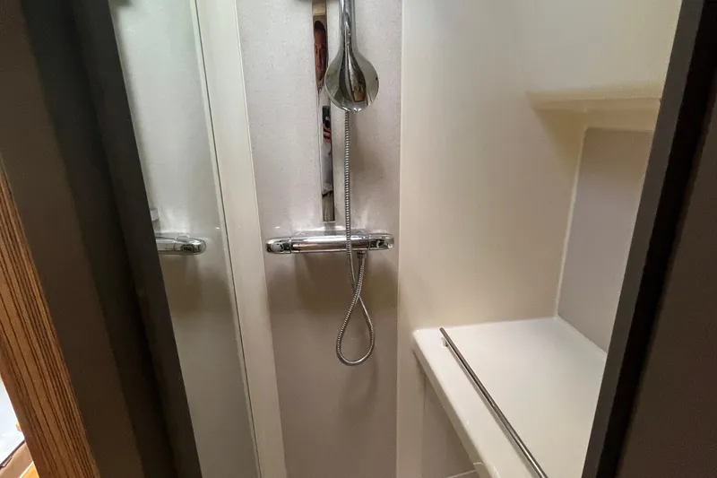 Slide: The Image of Shower area inside 2016 Chris-Craft Launch 36 boat, featuring modern fixtures and sleek design. - 31