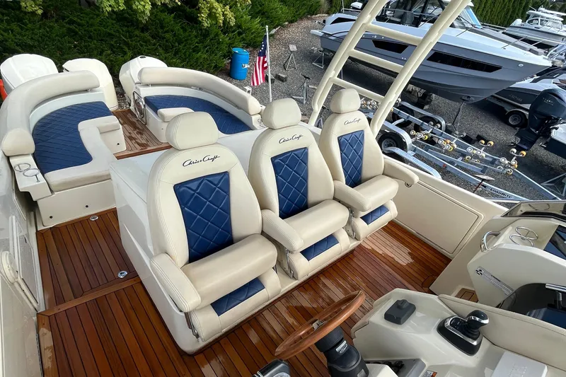 Slide: The Image of Luxurious 2016 Chris-Craft Launch 36 boat interior with elegant seating and wooden deck. - 38