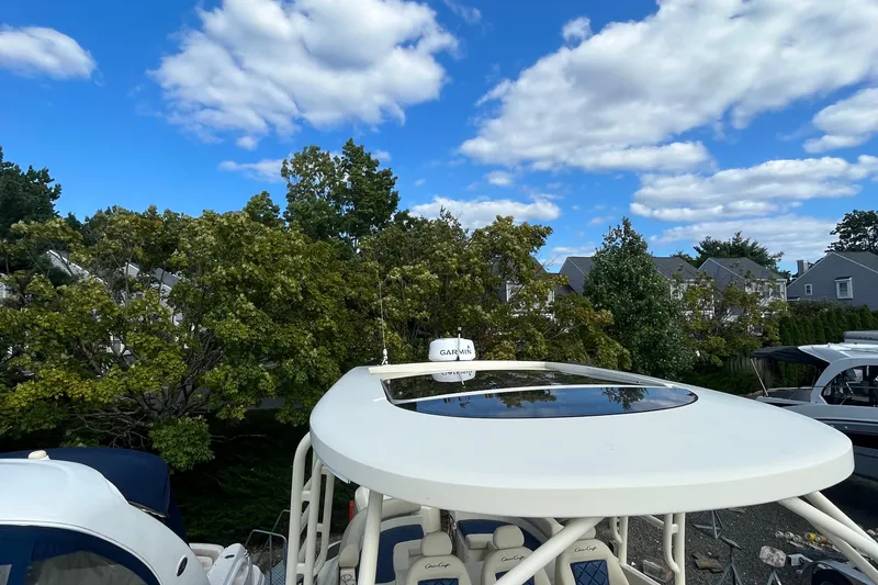 Slide: The Image of 2016 Chris-Craft Launch 36 boat with Garmin equipment, under a clear blue sky. - 40