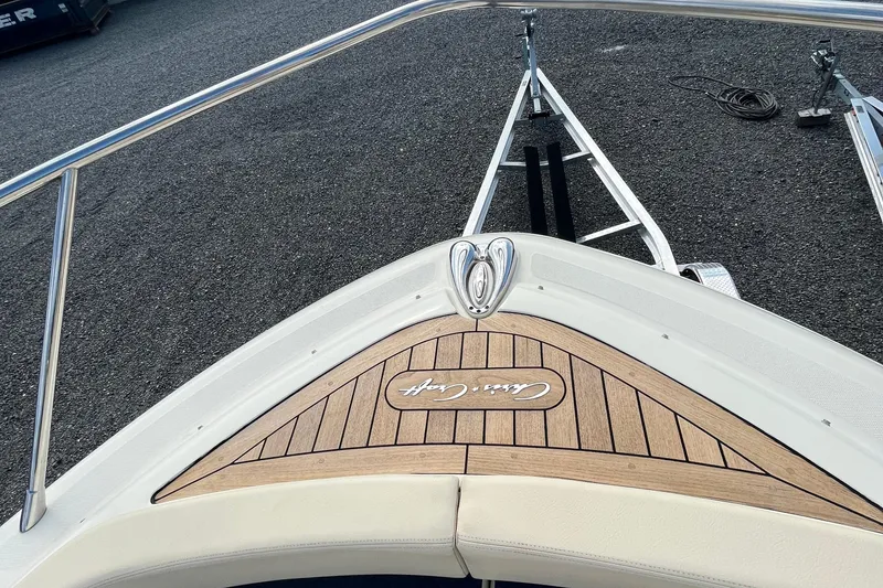 Slide: The Image of 2016 Chris-Craft Launch 36 boat bow with teak decking and logo. - 41