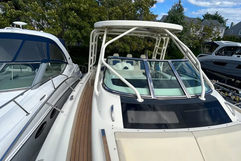 Slide: The Image of 2016 Chris-Craft Launch 36 boat with sleek design and spacious deck, docked alongside other vessels. - 43