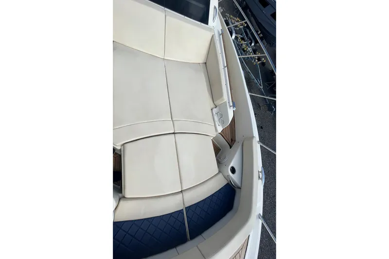 Slide: The Image of 2016 Chris-Craft Launch 36 boat interior with beige seating and cup holders. - 44