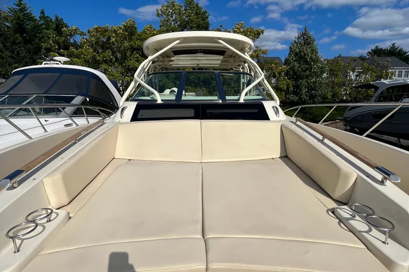 Slide: The Image of 2016 Chris-Craft Launch 36 boat with spacious seating and cup holders, docked outdoors. - 47