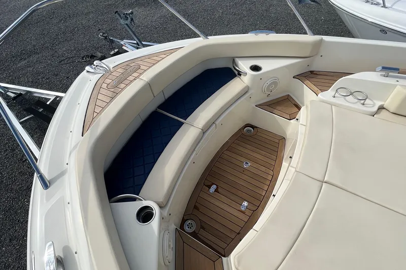 Slide: The Image of 2016 Chris-Craft Launch 36 boat interior with teak flooring and cushioned seating. - 49