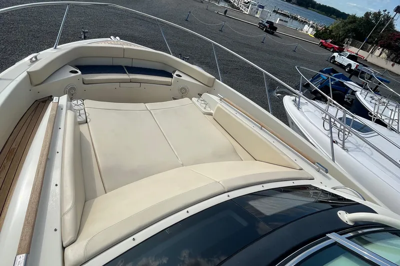 Slide: The Image of 2016 Chris-Craft Launch 36 boat with spacious deck and seating, docked near waterfront. - 50