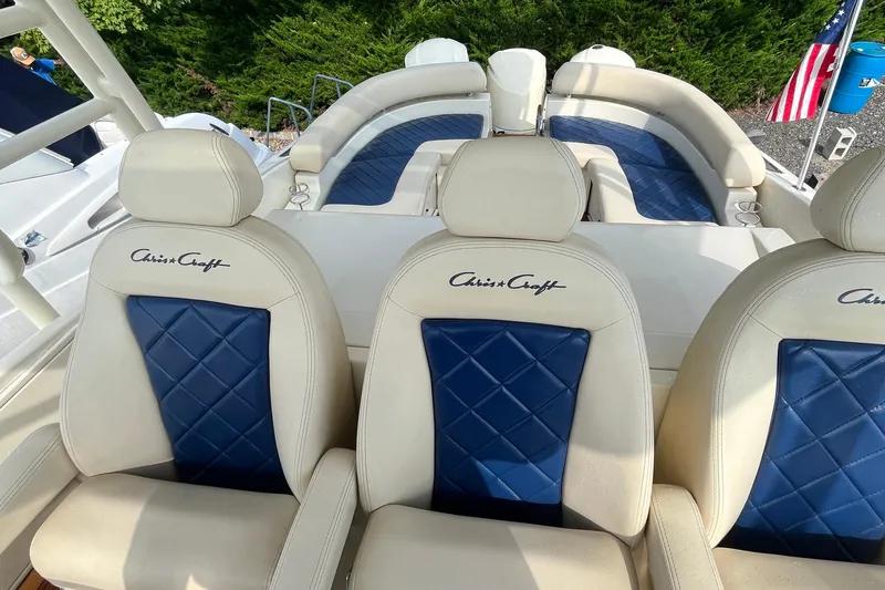 Slide: The Image of 2016 Chris-Craft Launch 36 boat with luxurious blue and white seating. - 56