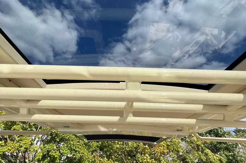 Slide: The Image of 2016 Chris-Craft Launch 36 boat roof with clear sky and clouds reflection. - 57