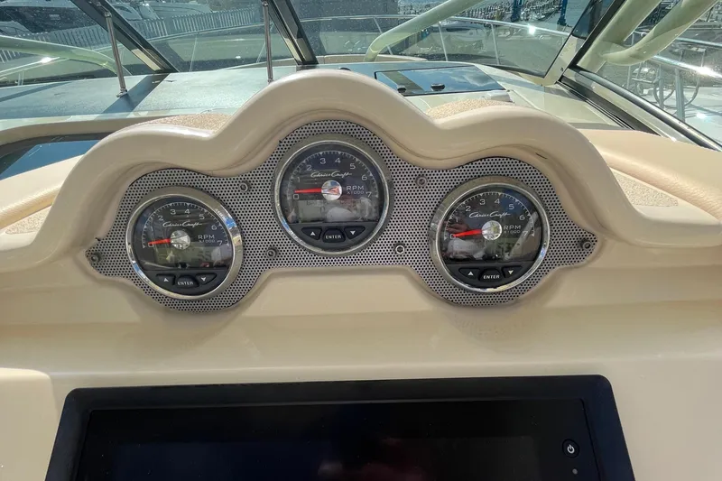 Slide: The Image of Dashboard of 2016 Chris-Craft Launch 36 boat with RPM gauges and controls. - 66