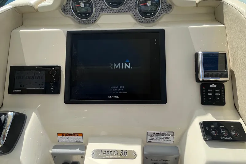 Slide: The Image of 2016 Chris-Craft Launch 36 dashboard with Garmin display and Yamaha controls. - 67