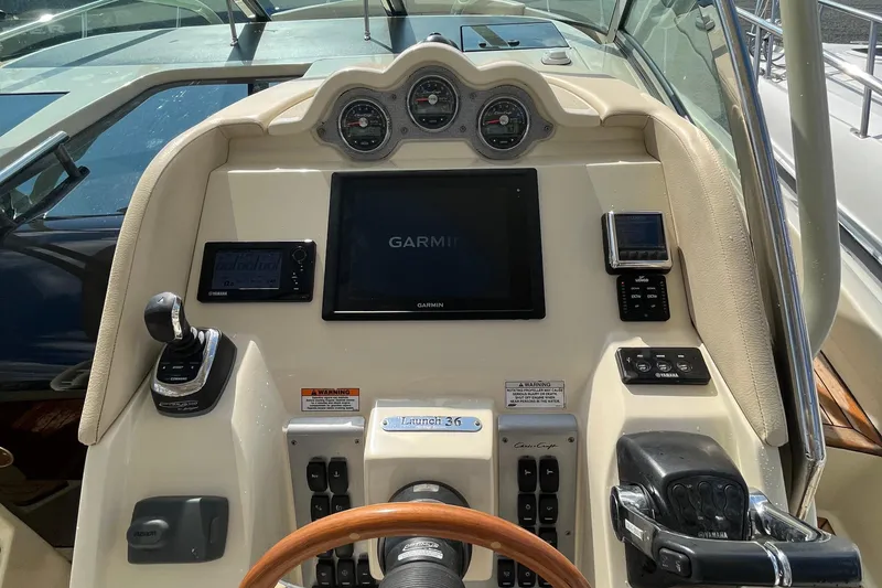 Slide: The Image of 2016 Chris-Craft Launch 36 dashboard with Garmin navigation and Yamaha controls. - 68