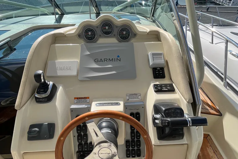 Slide: The Image of 2016 Chris-Craft Launch 36 dashboard with Garmin navigation and Yamaha controls. - 70
