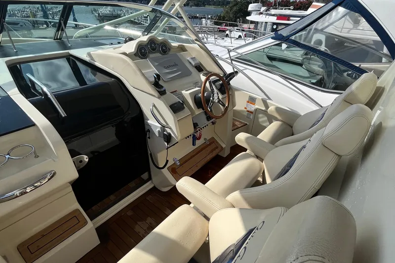 Slide: The Image of 2016 Chris-Craft Launch 36 cockpit with luxurious seating and modern navigation controls. - 72
