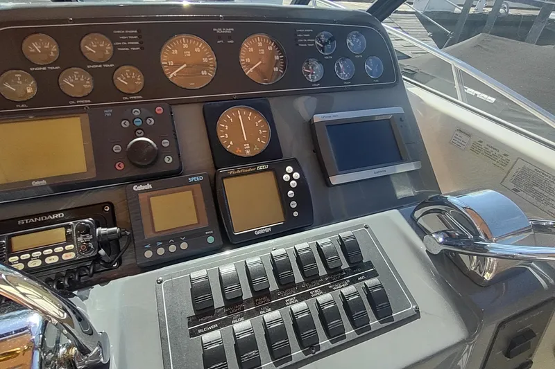 Slide: The Image of 1996 Tiara Yachts 3100 Open dashboard with gauges and navigation equipment. - 14