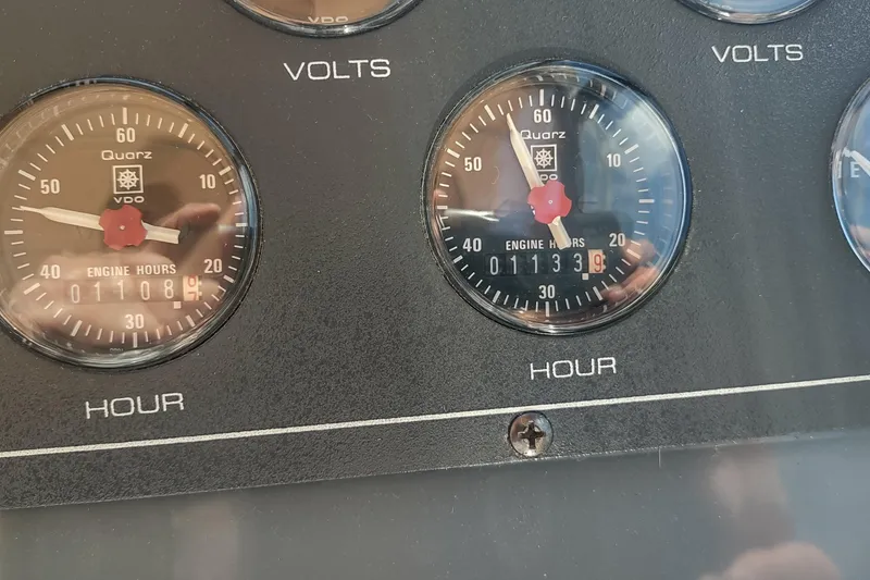 Slide: The Image of Close-up of Tiara Yachts 3100 Open 1996 engine hour meters displaying 1108 and 1133 hours. - 15
