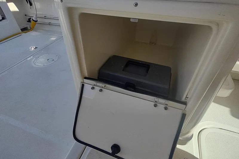 Slide: The Image of Open storage compartment on a 1996 Tiara Yachts 3100 Open boat deck. - 31
