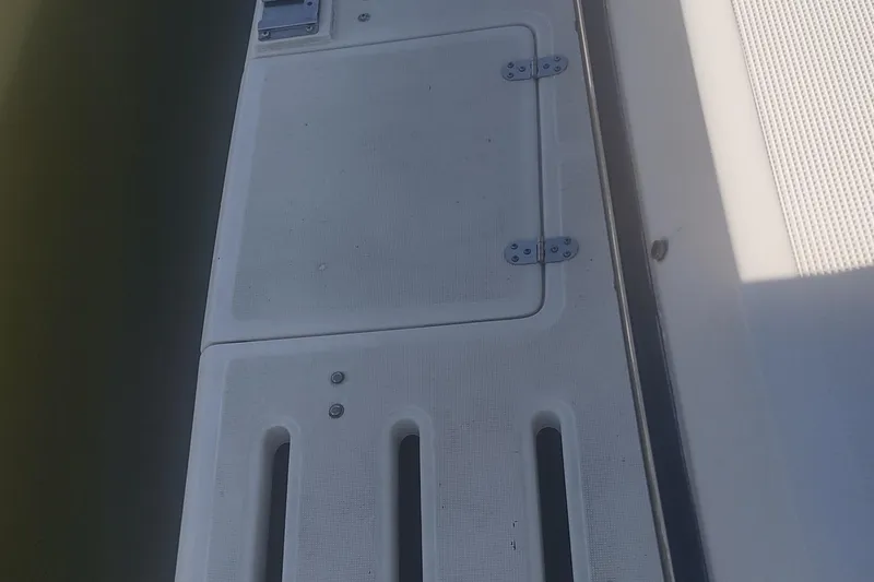 Slide: The Image of Deck view of a 1996 Tiara Yachts 3100 Open, featuring hatch and hinges. - 32