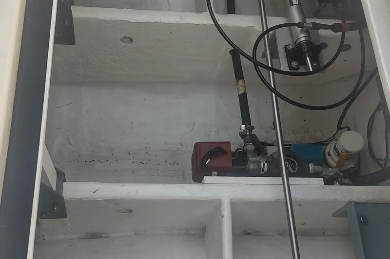 Slide: The Image of Engine compartment of a 1996 Tiara Yachts 3100 Open, showing mechanical components and wiring. - 34