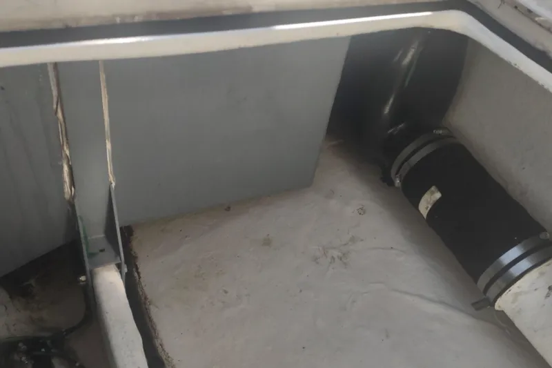 Slide: The Image of Engine compartment of a 1996 Tiara Yachts 3100 Open, showing interior components. - 36