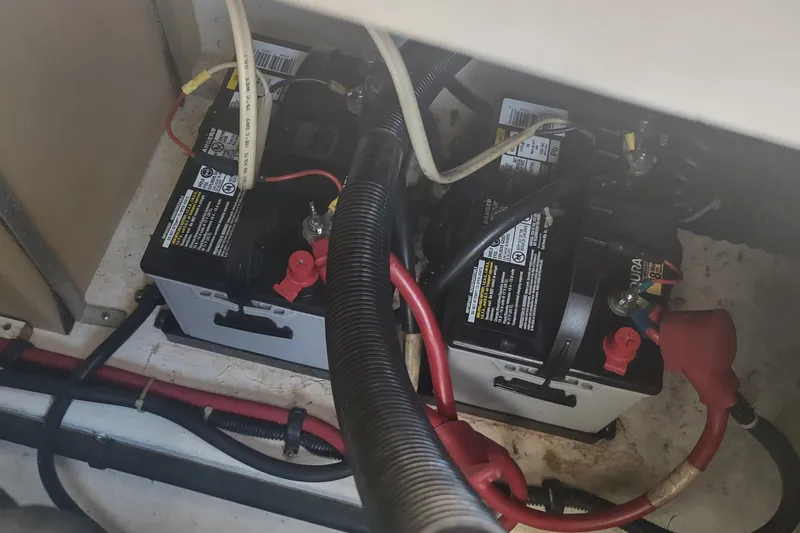 Slide: The Image of Batteries in a 1996 Tiara Yachts 3100 Open, showing wiring and connections. - 39