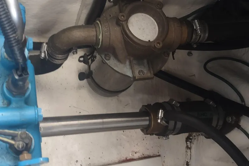 Slide: The Image of Engine compartment of a 1996 Tiara Yachts 3100 Open, showing mechanical components and hoses. - 41