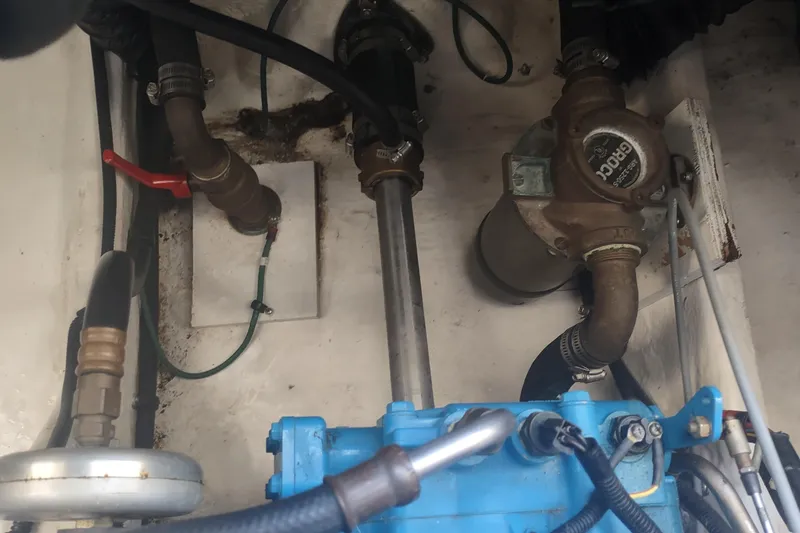 Slide: The Image of Engine compartment of a 1996 Tiara Yachts 3100 Open, showing mechanical components and piping. - 42