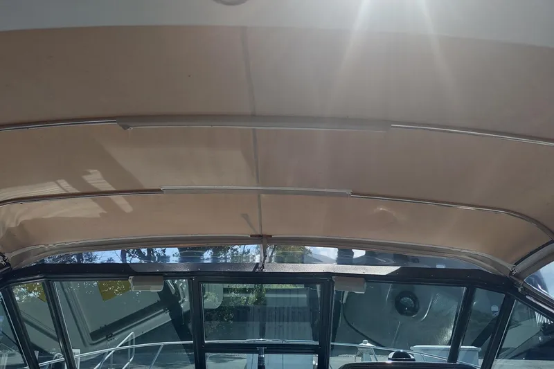 Slide: The Image of 1996 Tiara Yachts 3100 Open interior view with sunlight streaming through the canopy. - 43