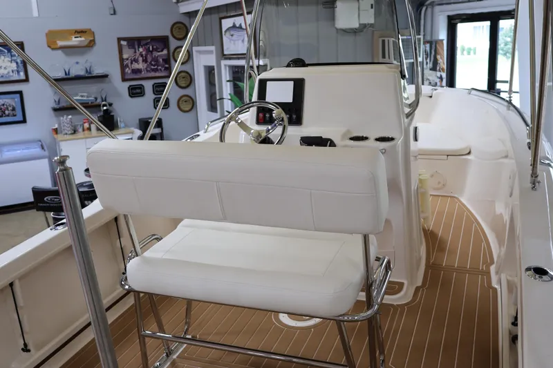 Slide: The Image of 2026 Grady-White Fisherman 180 boat interior with white seating and modern console. - 7