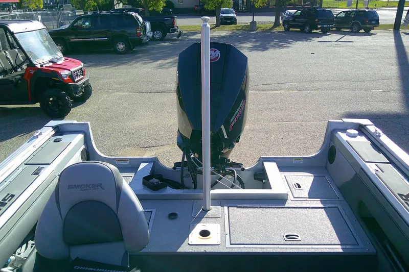 Slide: The Image of 2022 SMOKERCRAFT 182 Pro Angler XL boat with outboard motor in parking lot. - 12