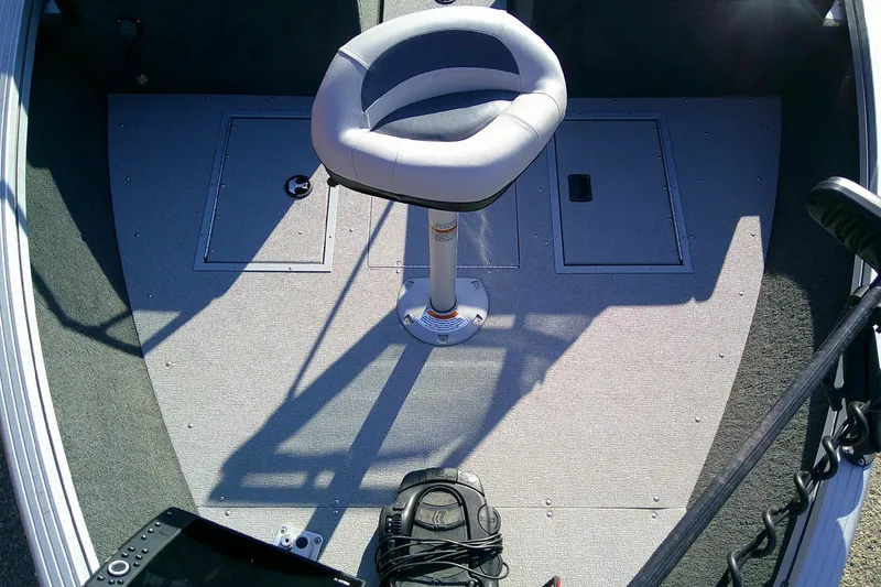 Slide: The Image of 2022 SMOKERCRAFT 182 Pro Angler XL boat interior with swivel seat and storage compartments. - 15