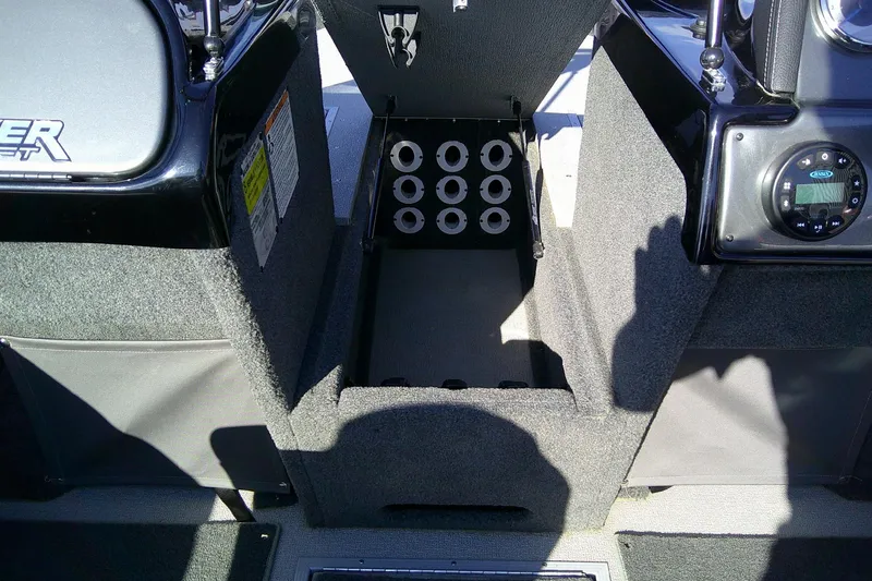 Slide: The Image of 2022 SMOKERCRAFT 182 Pro Angler XL boat interior storage compartment with rod holders. - 17