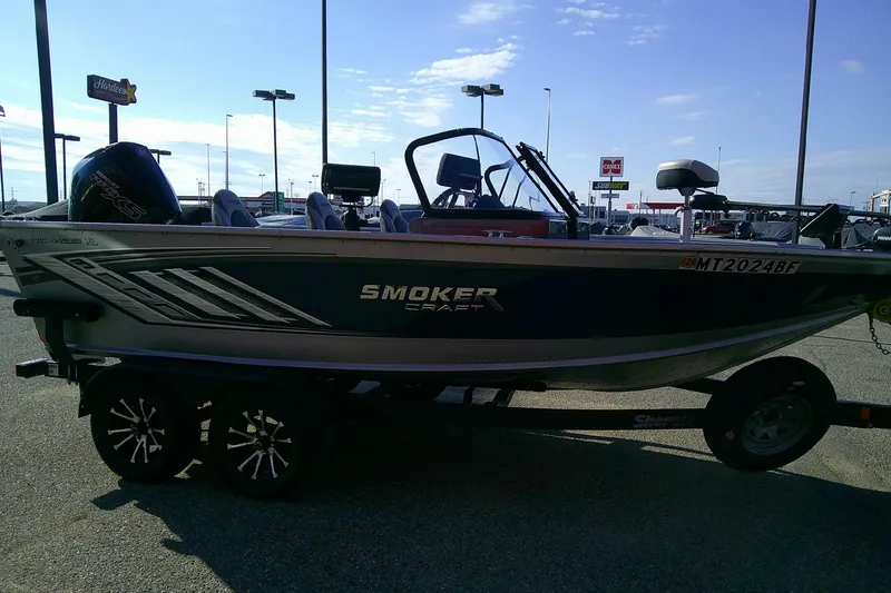 Slide: The Image of 2022 SMOKERCRAFT 182 Pro Angler XL boat on trailer in parking lot. - 3