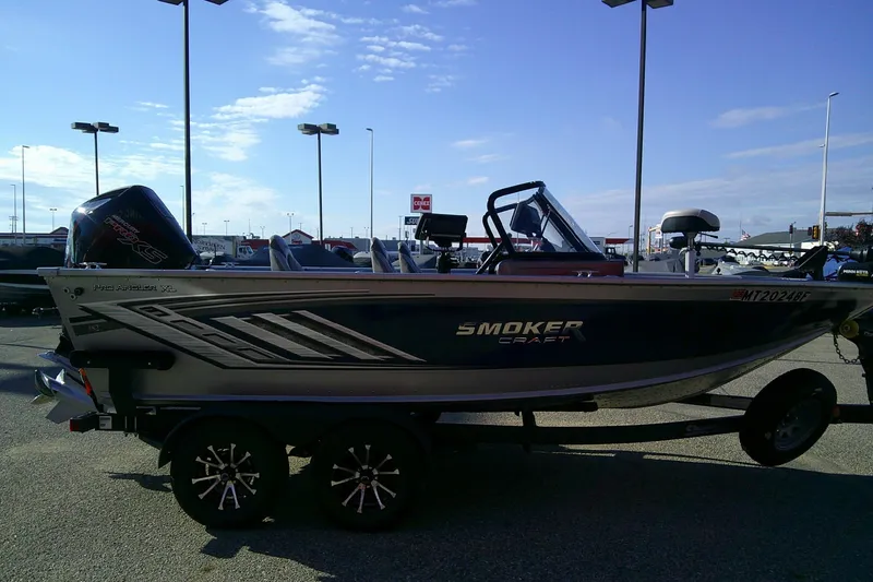 Slide: The Image of 2022 SMOKERCRAFT 182 Pro Angler XL boat on trailer in parking lot. - 5