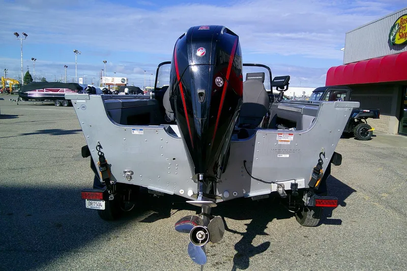 Slide: The Image of 2022 SMOKERCRAFT 182 Pro Angler XL boat with outboard motor in a parking lot. - 7