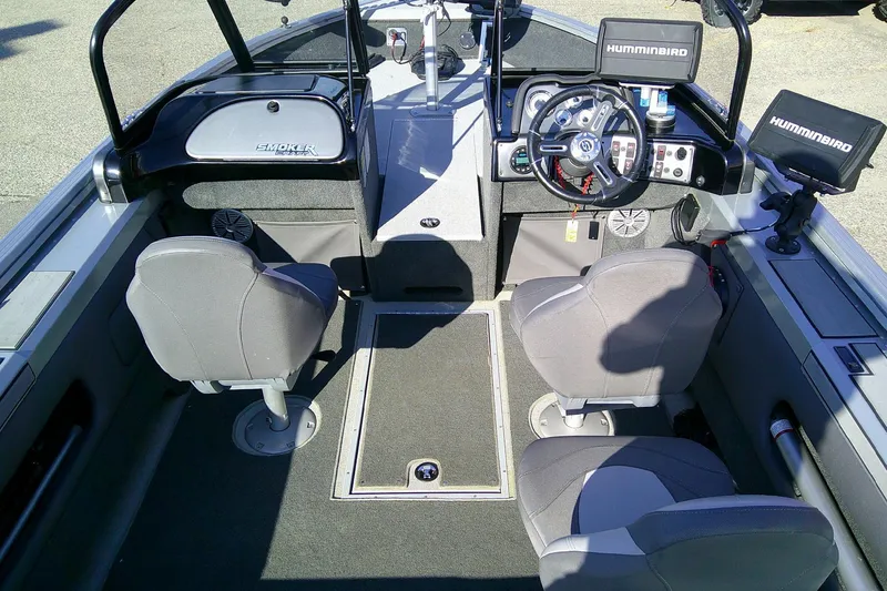 Slide: The Image of 2022 SMOKERCRAFT 182 Pro Angler XL boat interior with dual seats and navigation equipment. - 8