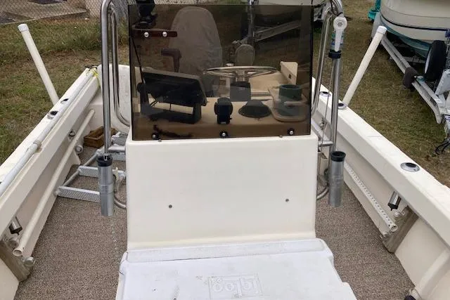 Slide: The Image of 1991 Parker 1801 Center Console boat interior with steering wheel and equipment. - 3